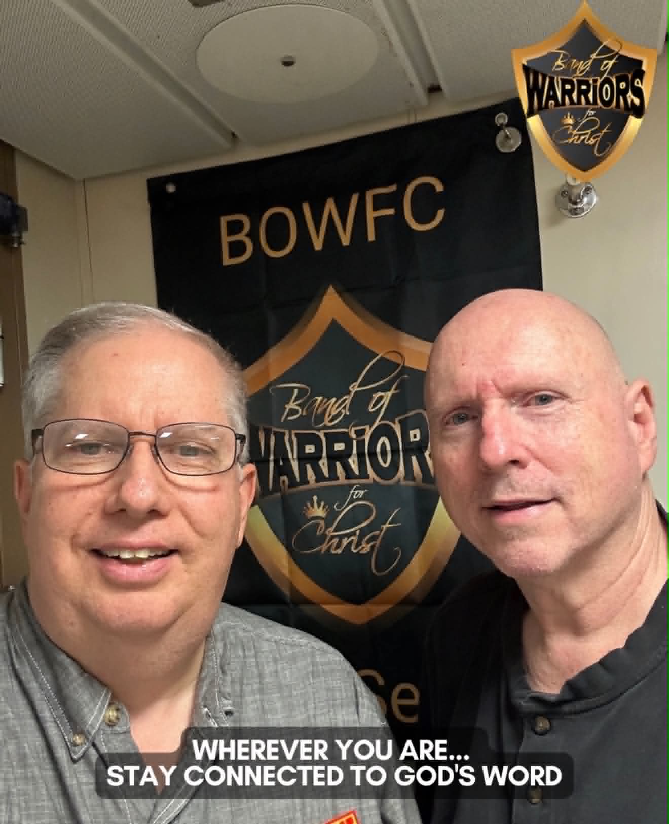 Elder Jeffery Gill and a fellow believer with the BOWFC at Sea banner